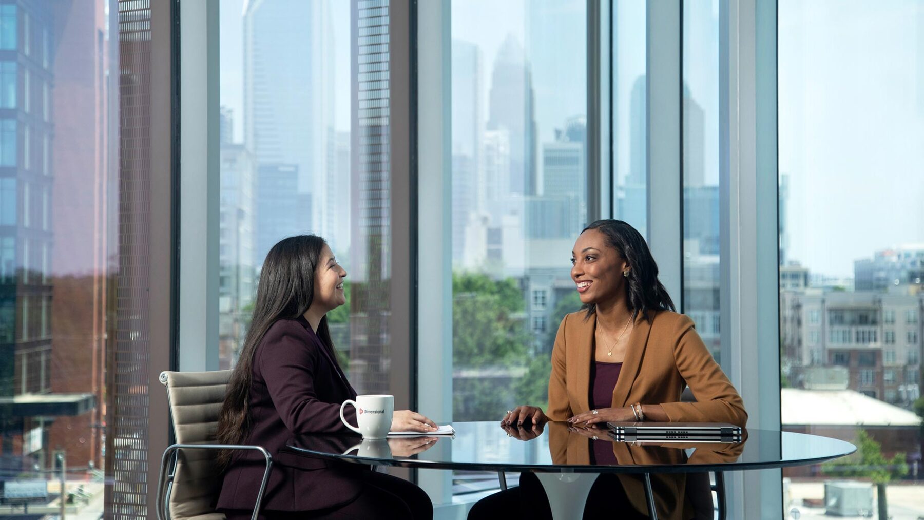 Two Dimensional employees happily meeting for coffee.